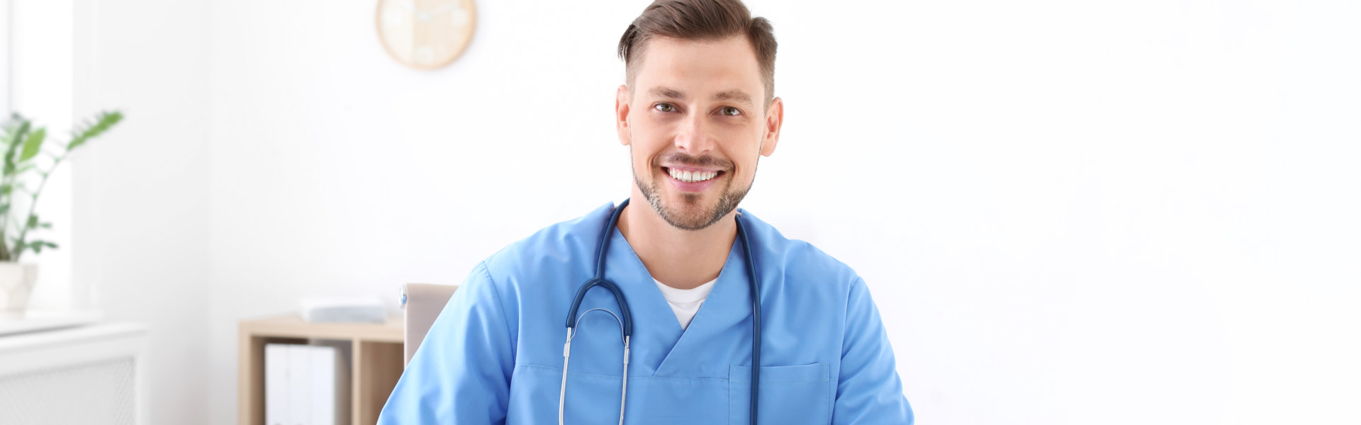 nurse with stethoscope smiling